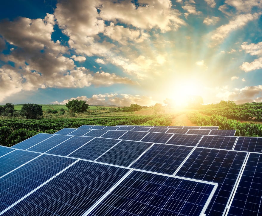 Sunset over Solar energy Farm plant